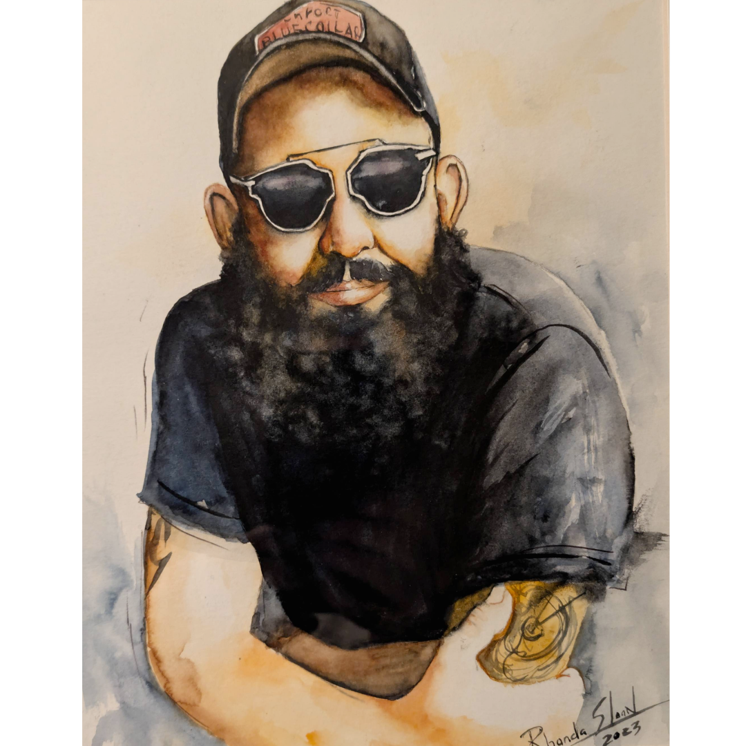 Custom watercolor portrait of a person wearing sunglasses and a cap with a tattooed arm, signed 'Rhonda Sloan'.