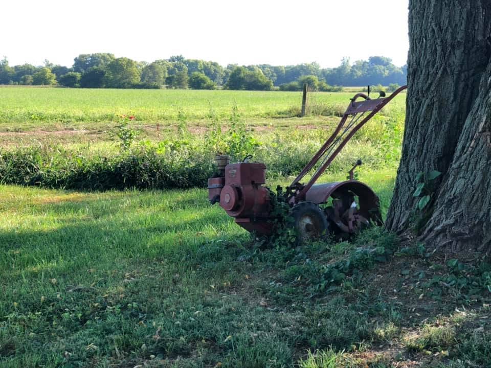 Photo Reference for a Watercolor painting of Custom Landscape - Baumgardner Homestead, New Carlisle, Ohio. Old plow leaning against a tree in a grassy field